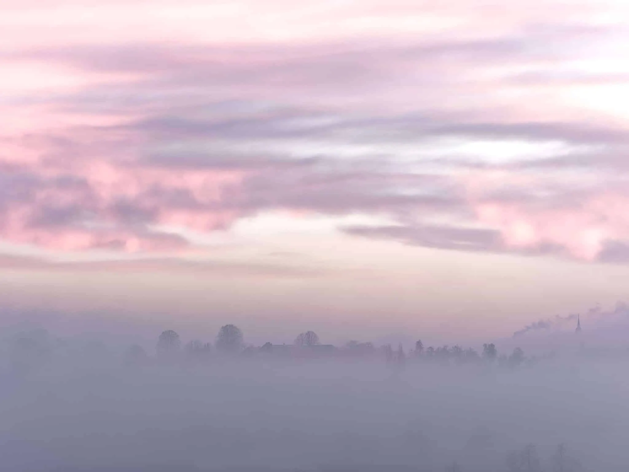 2023 Secret-11-2 purple clouds in a hazy sky