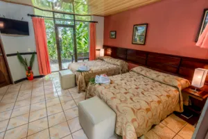 hotel room with a rear patio and large windows