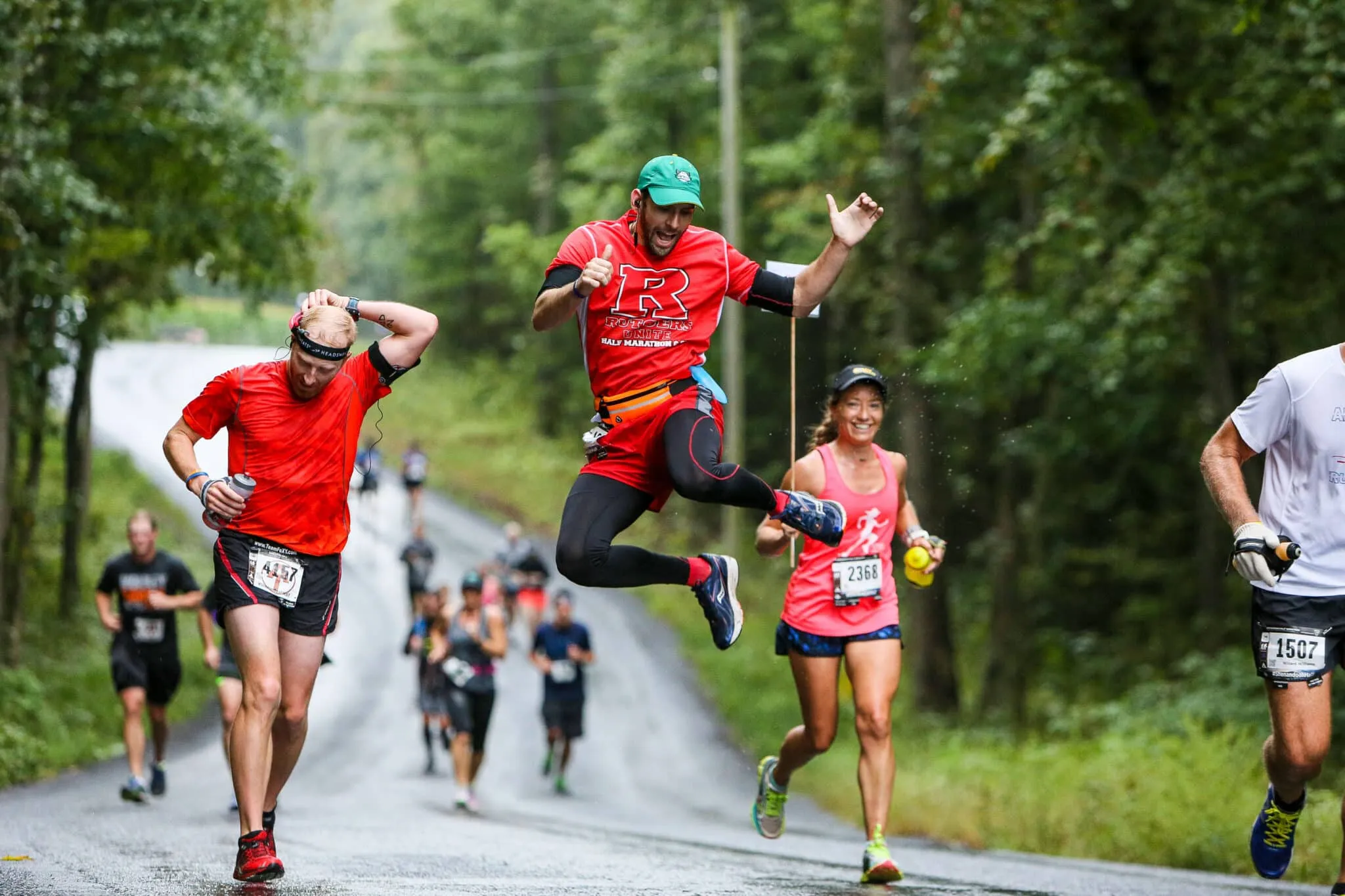 Shenandoah 20171507 2368-2 A group of runners jump, smile, and pose ont he Vacation Races Shenandoah Half Marathon course